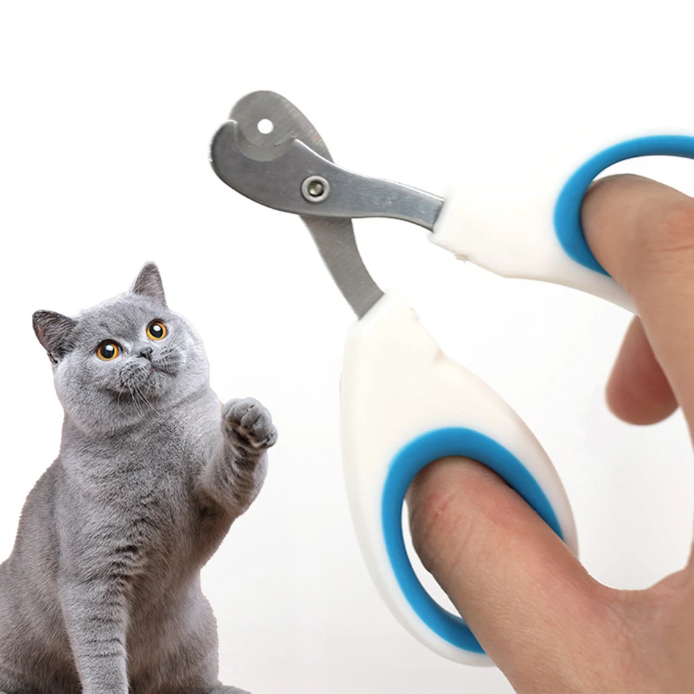 Cat nail clippers with a circular hole guide and blue handles, grey cat in the background